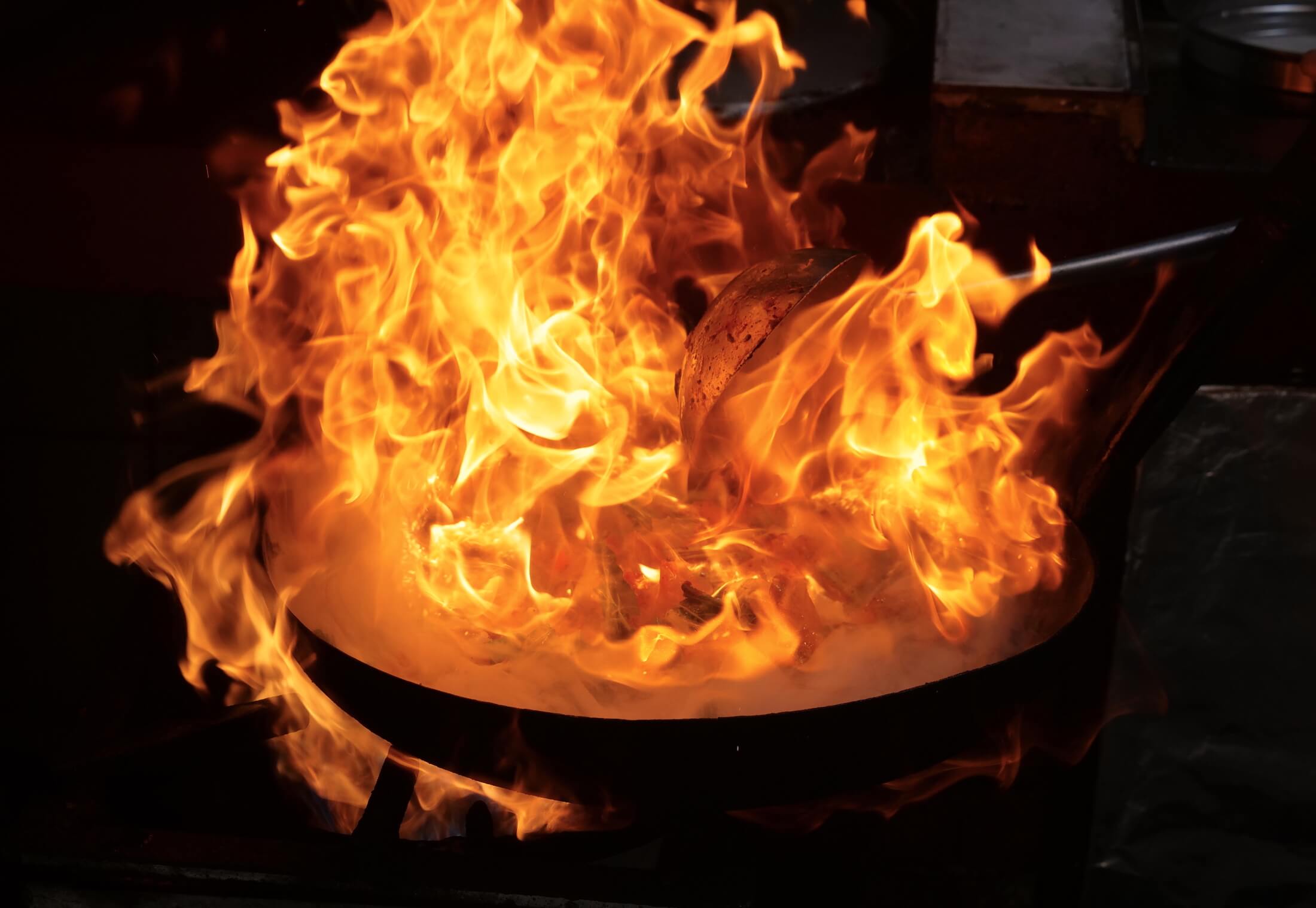 It's amazing to see the amount of fire Chef Wong uses while cooking