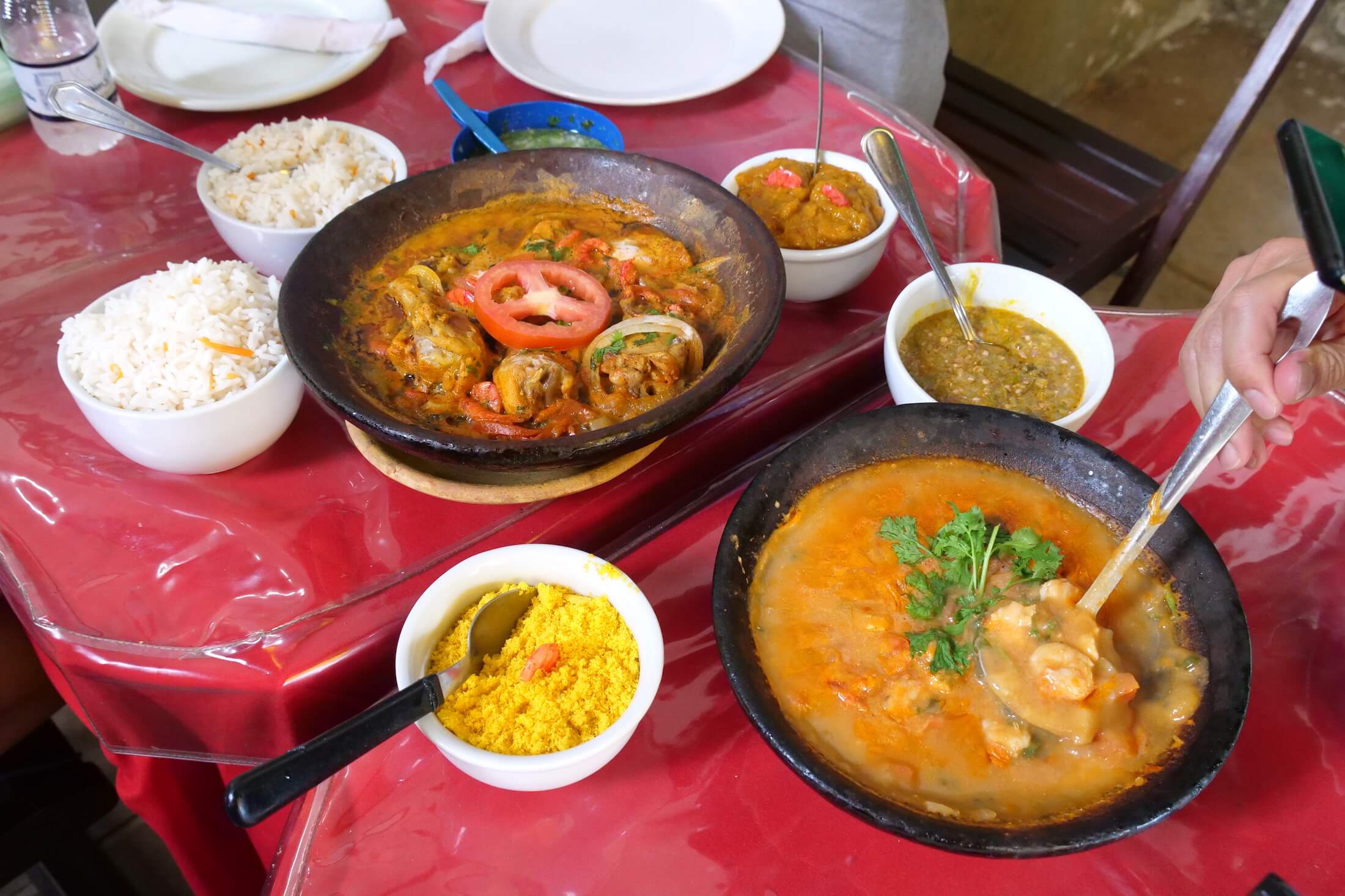 amazing local meal of stews, pastes, and dry powders, all spicy, delicious, and all served with white rice