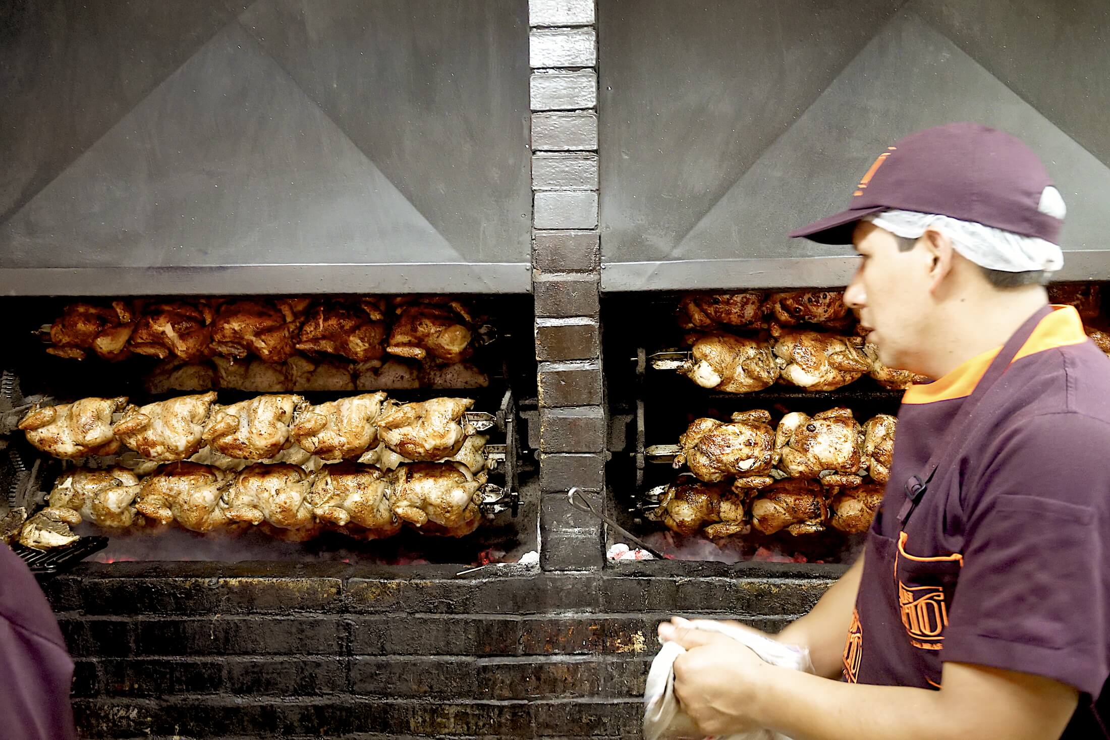 Pollo a la Brasa grilling chickens at Don Tito's