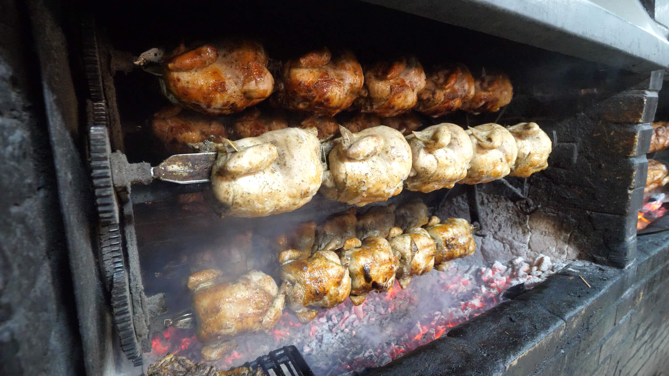 pollo a la brasa grilling chickens at Don Tito's