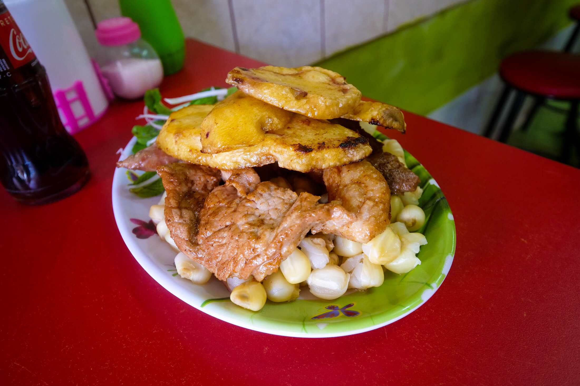 Order just one plate of Chicharrones for a full selection of porky parts.