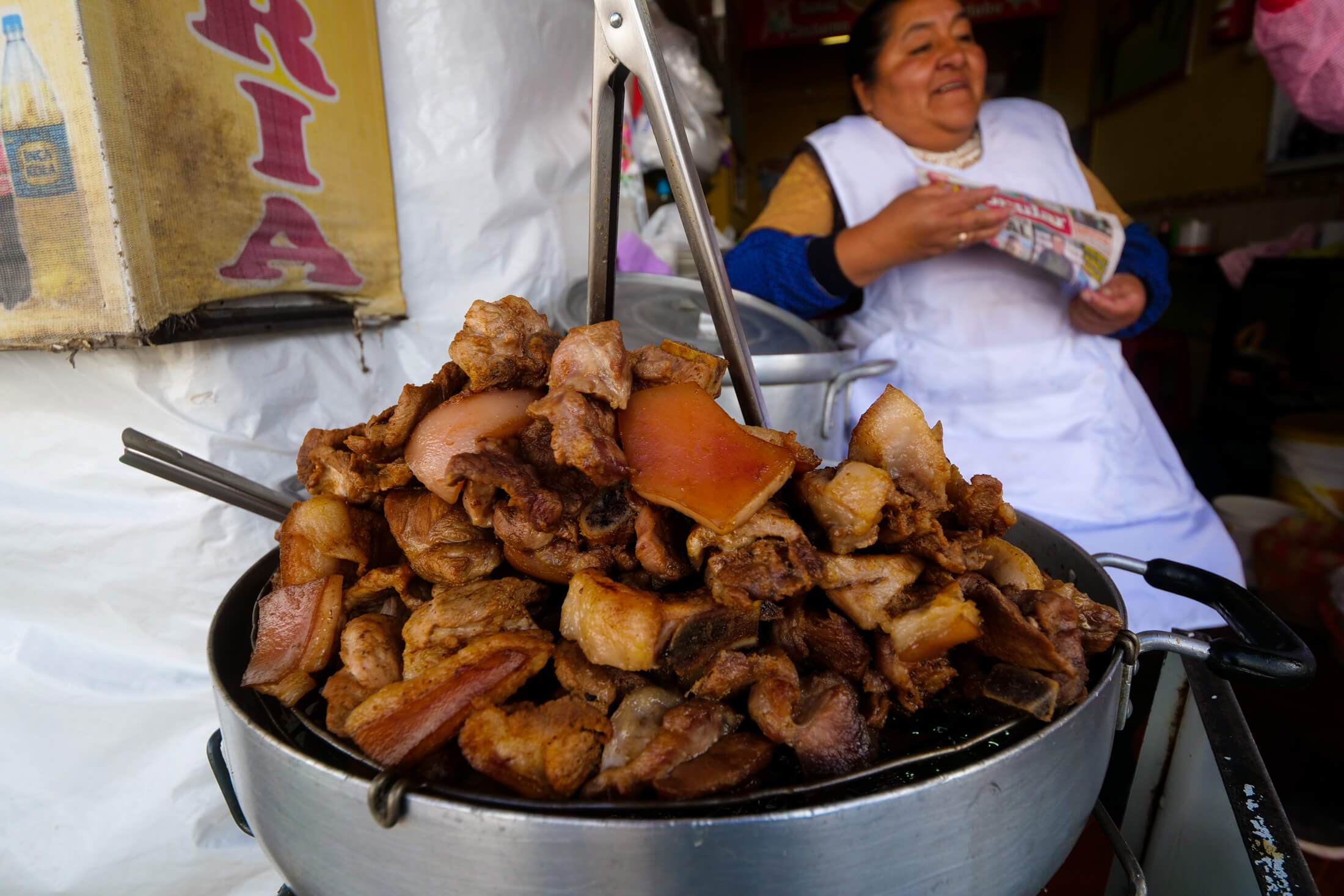 Monster Oil Pan full of Chicharrone pork parts in Cusco