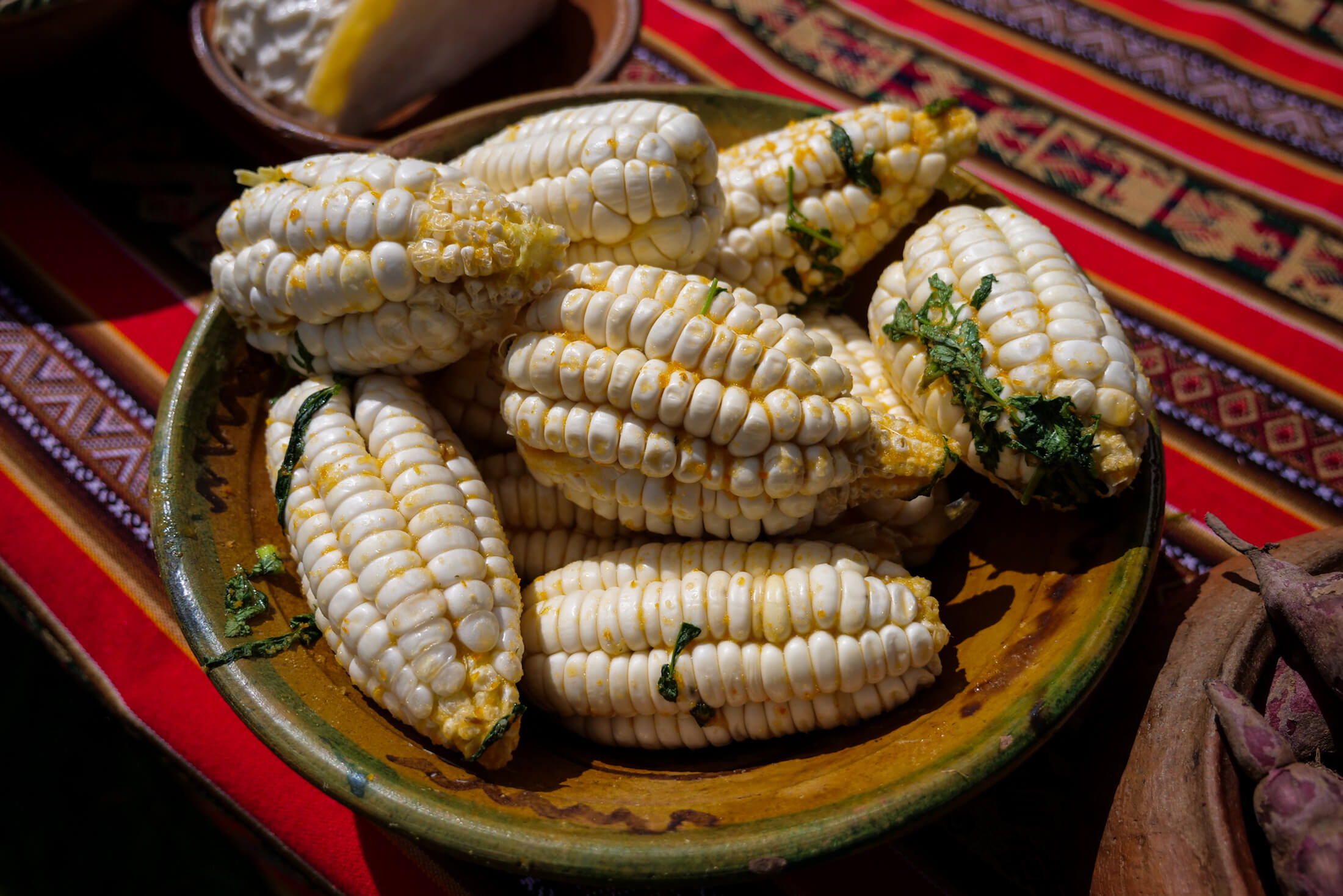 these massive-kernel ears of corn (choclo) Are also key ingredients to the Pachamanca