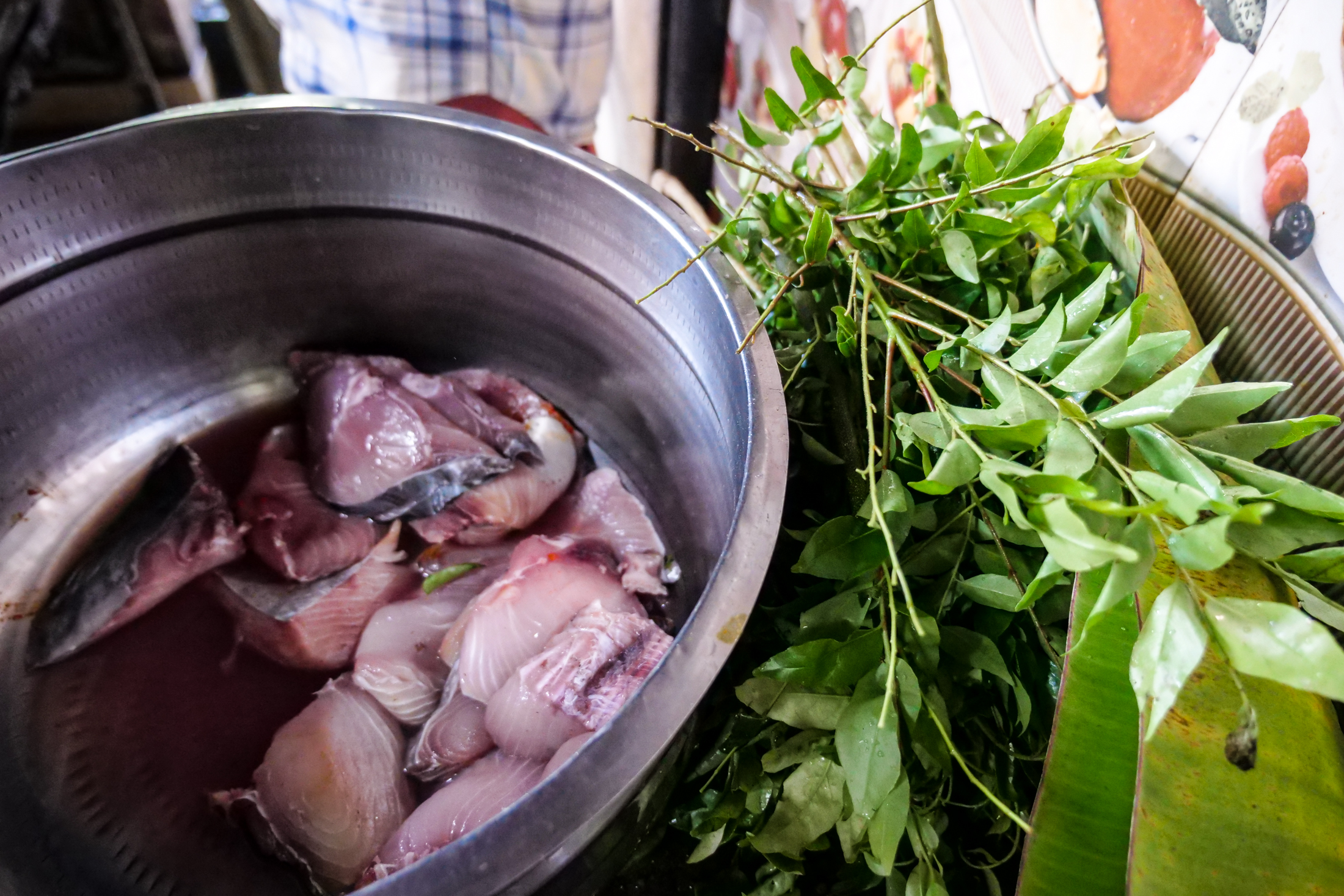 Kingfish, and fresh Curry leaves, awaiting their turn in the lava pan...
